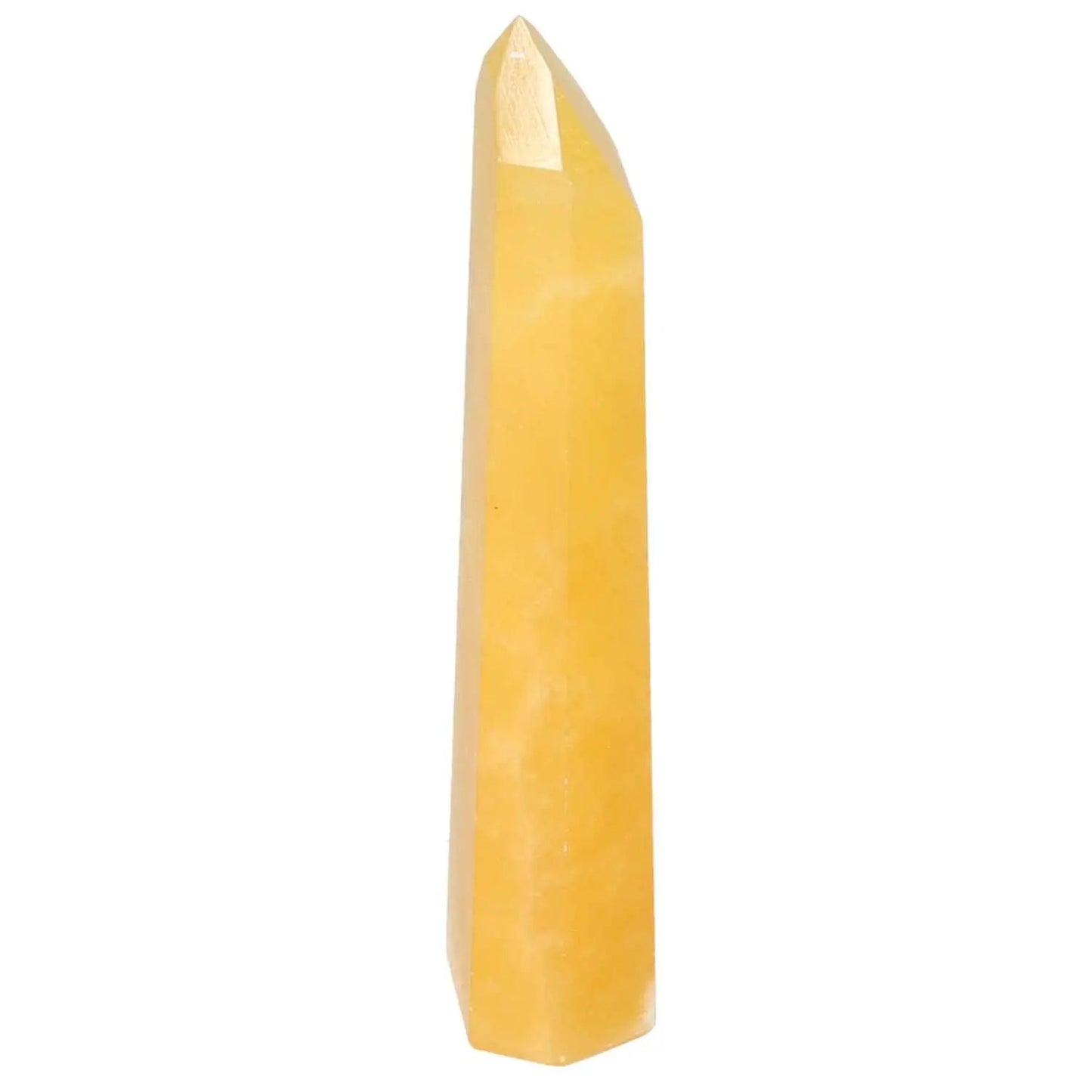 Elegant Mexican Calcite Obelisk from Sylvia Crystals, exemplifying luxury, quality, and spiritual significance in crystal decor.