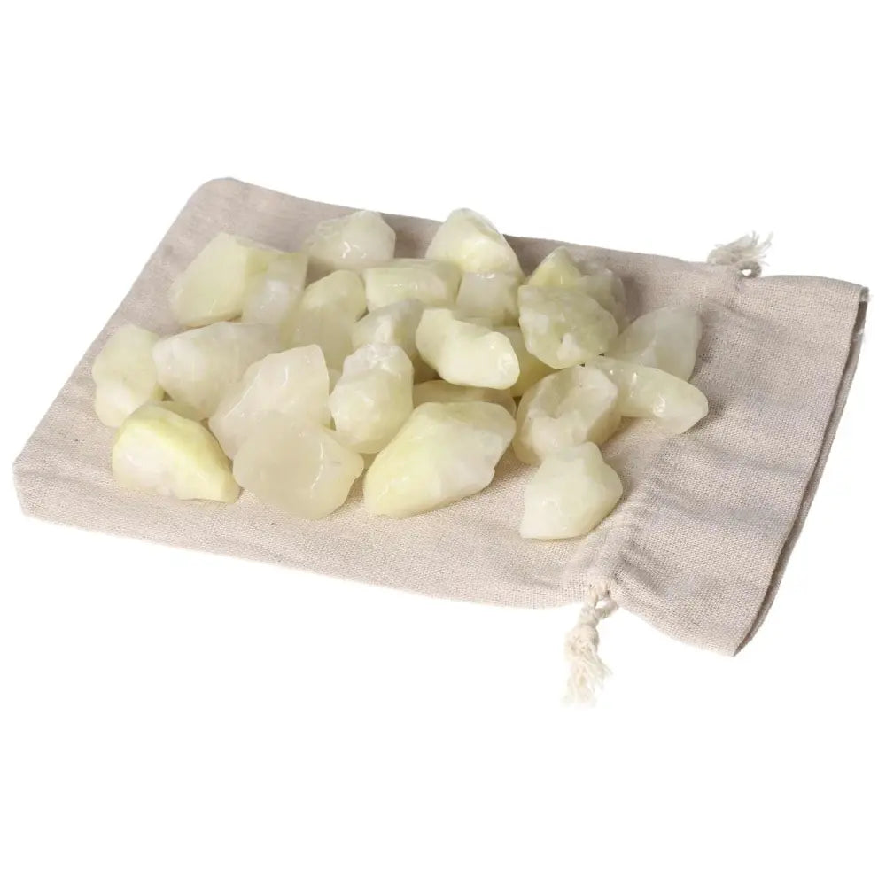 Tumbled Sulphur stones 1KG 30PCS displayed on a beige cloth bag, showcasing vibrant yellow hues and polished elegance from Sylvia Crystals.