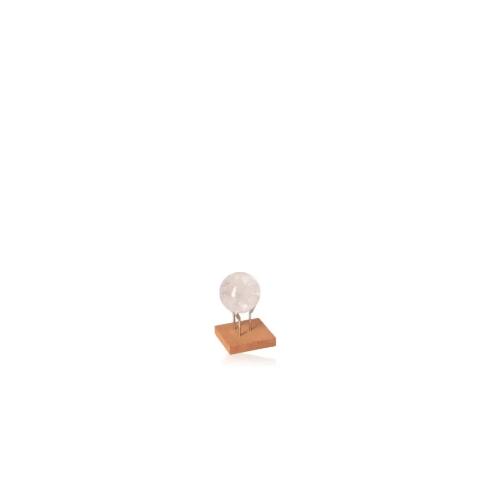 Lemurian Quartz Sphere on wooden stand, perfect for spiritual alignment and natural healing décor.
