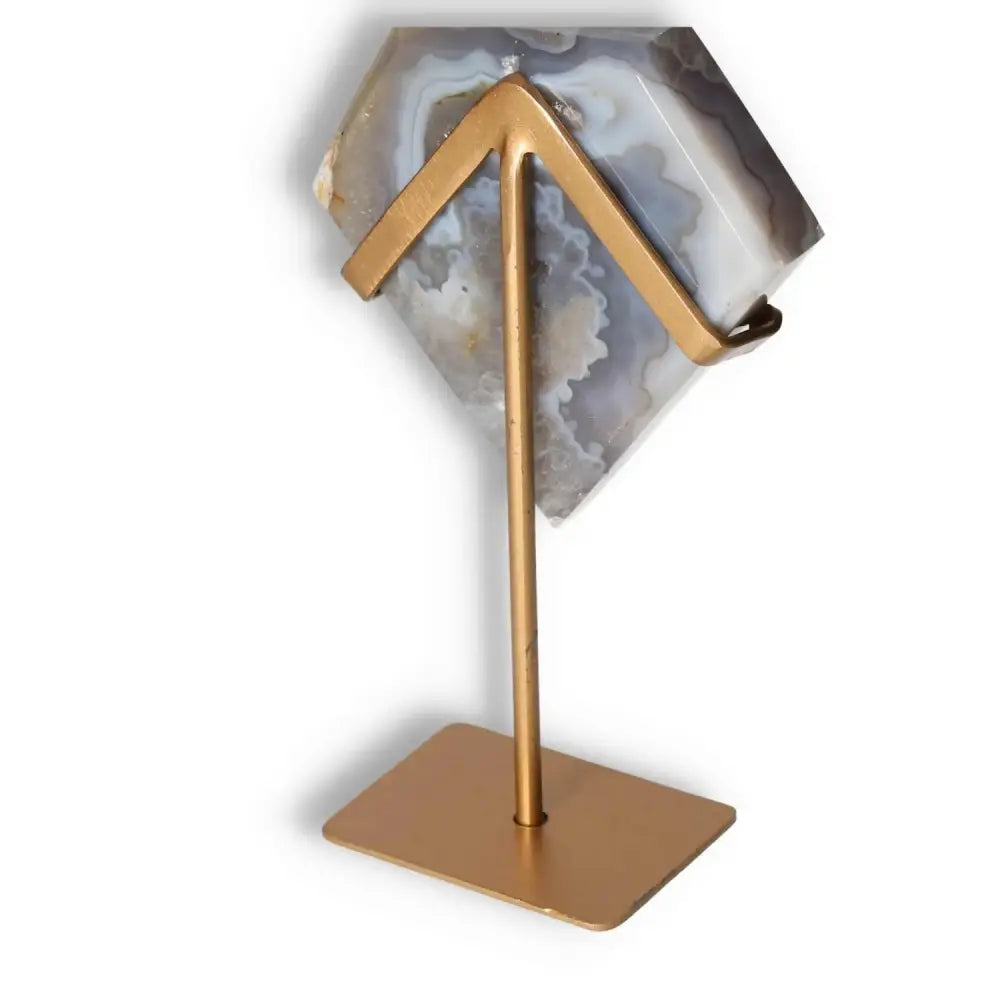 Agate freeform decoration on stand, showcasing unique patterns and natural translucency, blending organic artistry with refined elegance.