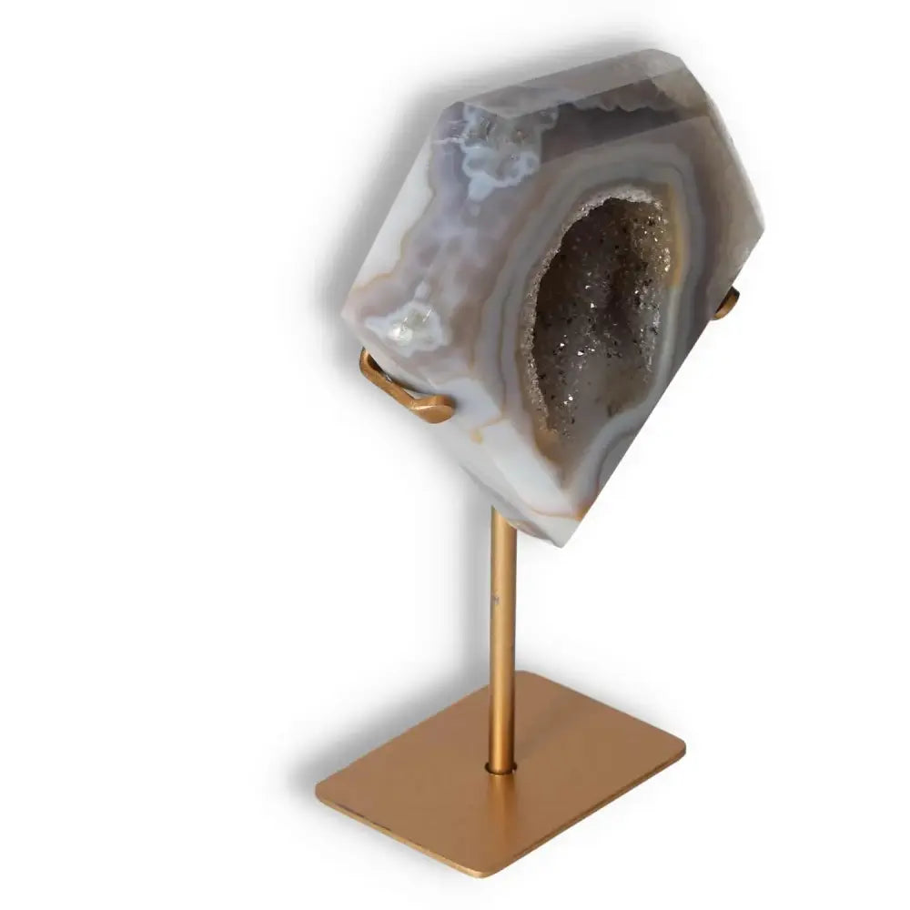 Elegant agate decoration on stand, featuring natural patterns and crystal formations, showcasing organic artistry and refined elegance.