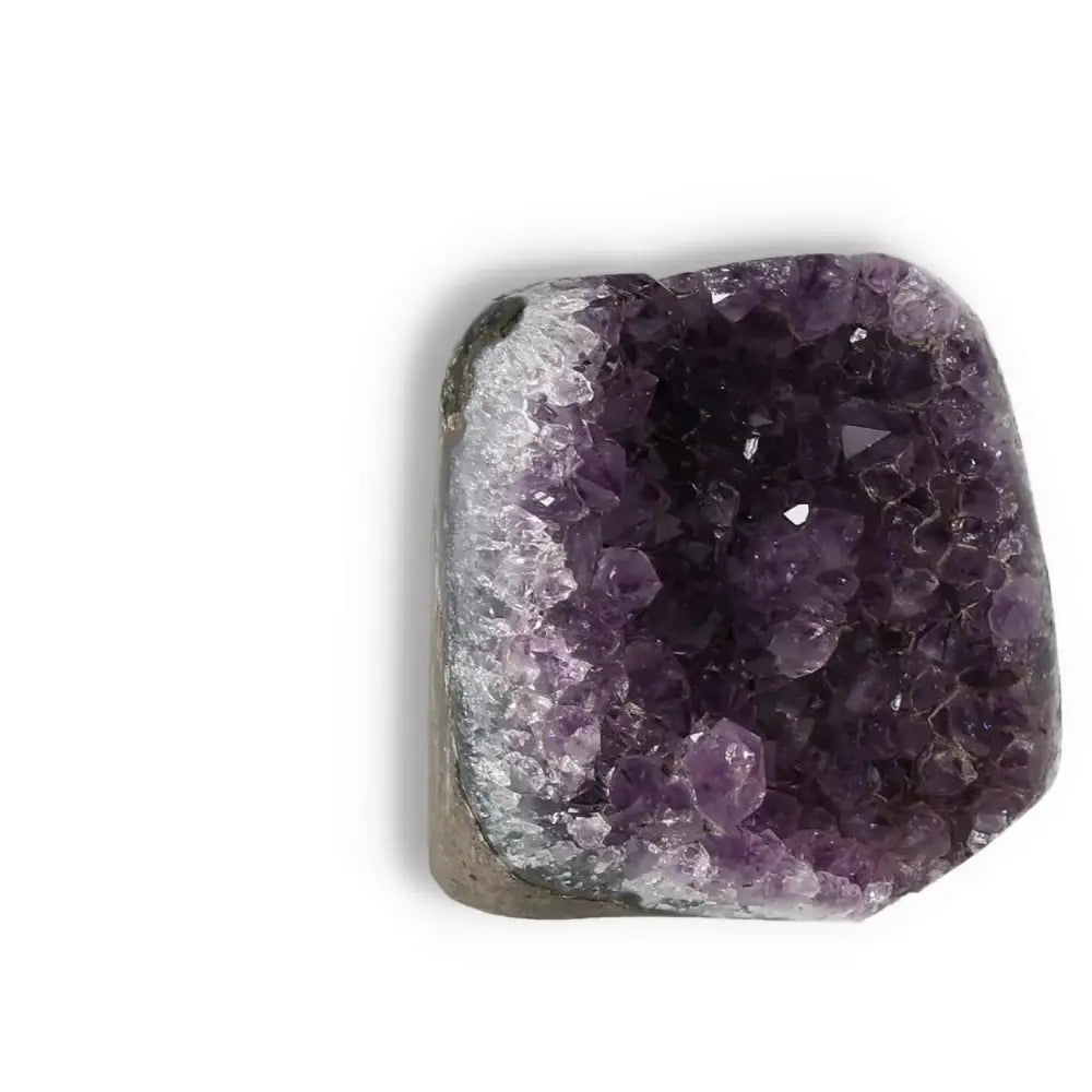 Amethyst Cut Base Geode from Sylvia Crystals' collection, showcasing luxurious purple crystals and enhancing space aesthetics.