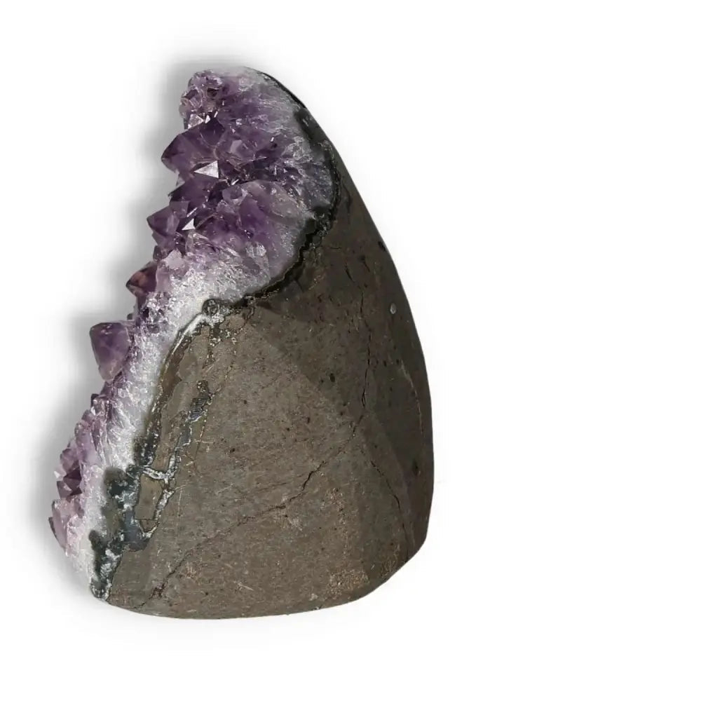Amethyst Cut Base Geode with purple crystal formation from Sylvia Crystals' collection, enhancing tranquility and aesthetic appeal.