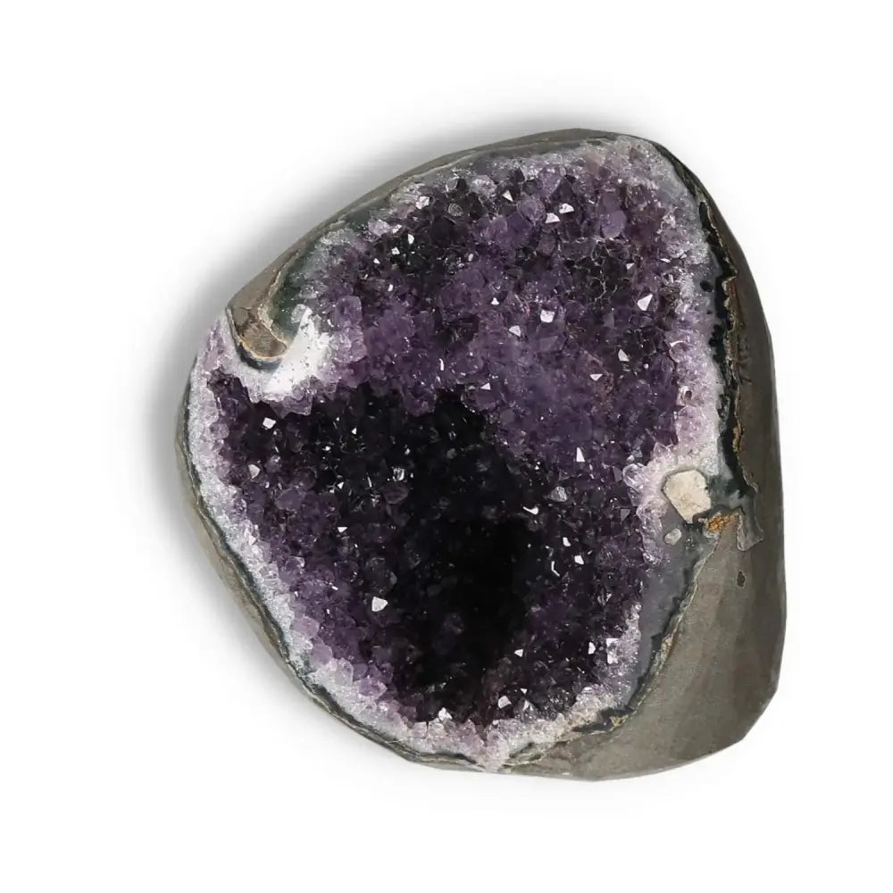 Amethyst Cut Base Geode with vibrant purple crystals, Sylvia Crystals. Enhances energy and reduces stress, perfect for any space.