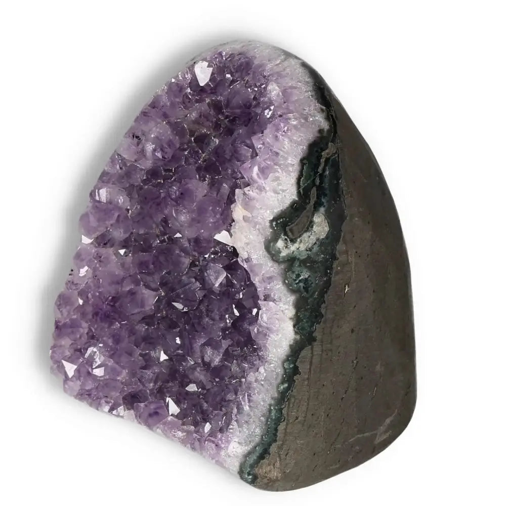 Amethyst Cut Base Geode by Sylvia Crystals showcasing vibrant violet hues, ideal for luxury decor and enhancing concentration.
