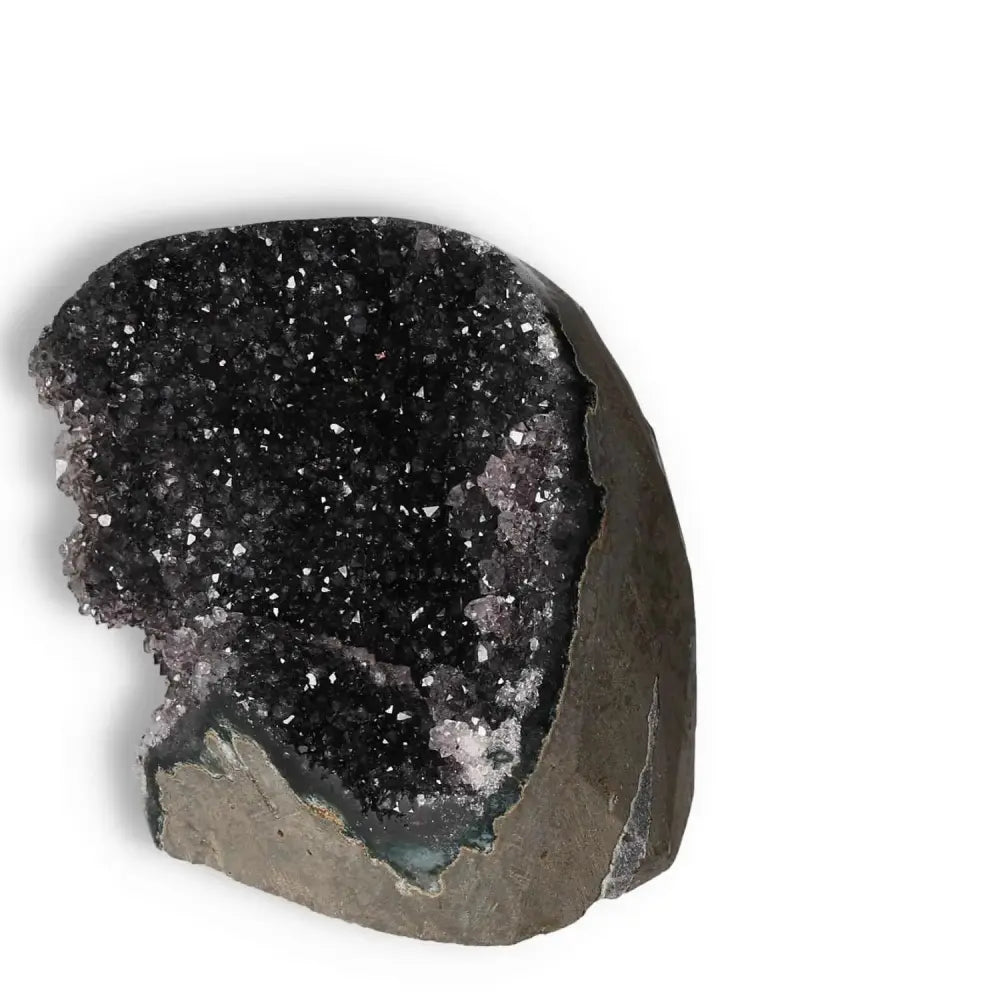 Amethyst cut base geode with sparkling crystals from Sylvia Crystals, symbolizing luxury and tranquility in home decor.