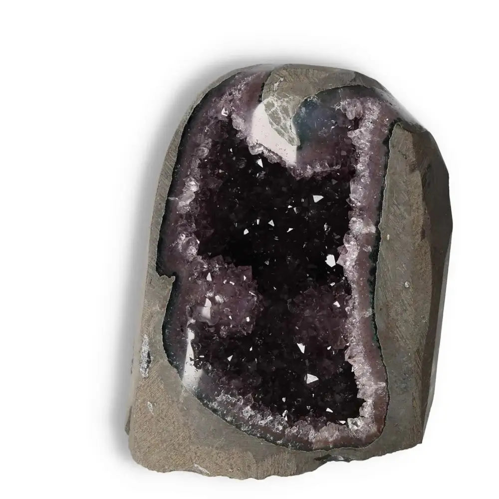 Amethyst Cut Base Geode by Sylvia Crystals, showcasing deep purple hues and natural elegance for conscious living.