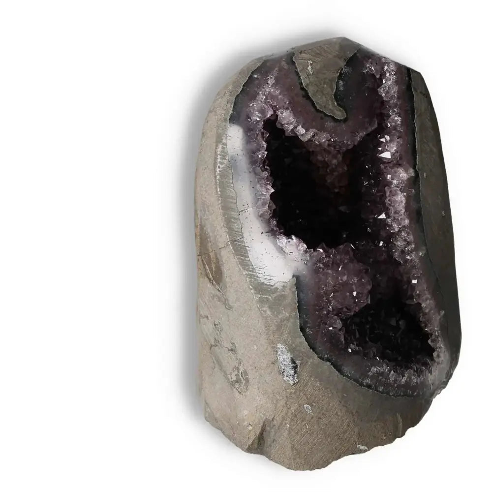 Amethyst Cut Base Geode by Sylvia Crystals, showcasing deep purple hues and natural elegance for conscious living.
