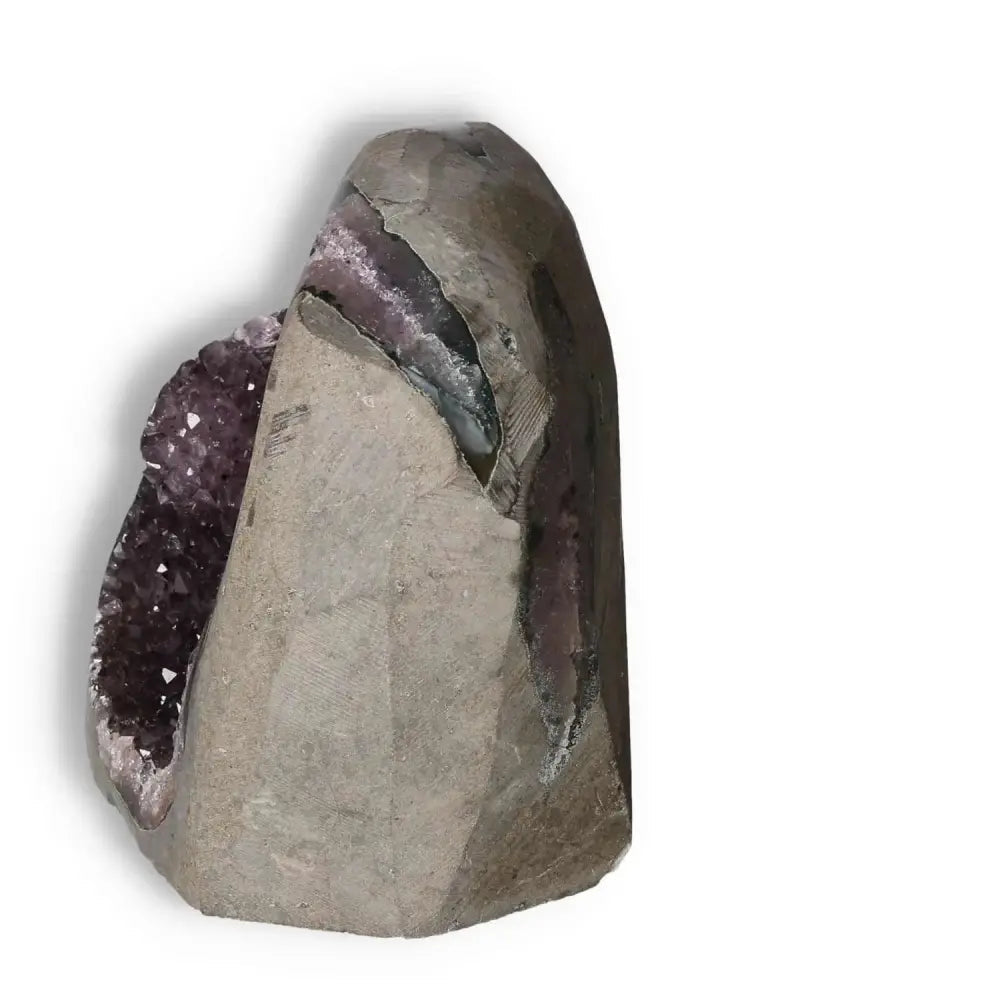 Amethyst Cut Base Geode with deep purple crystals by Sylvia Crystals, showcasing natural elegance and conscious living principles.