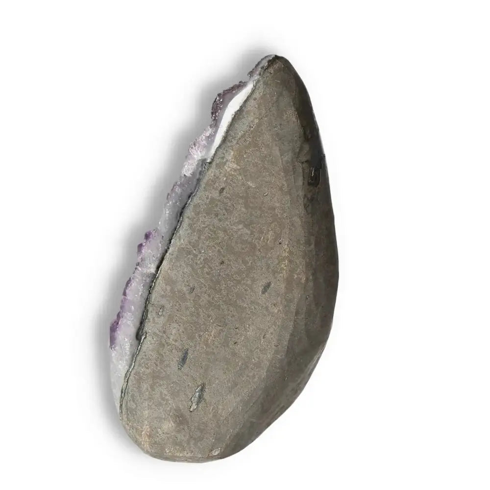 Side view of Amethyst Cut Base Geode from Sylvia Crystals, showcasing natural texture and calming purple hues for stress reduction.