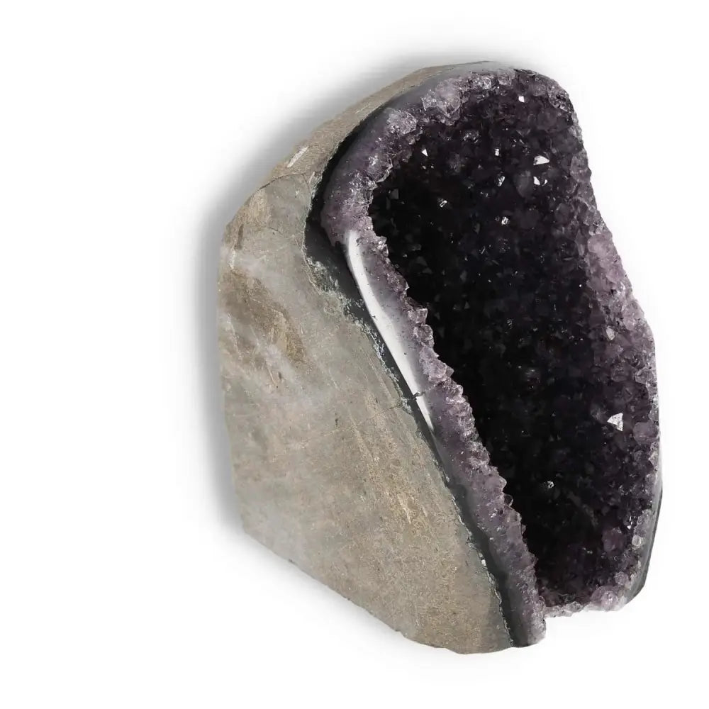 Amethyst Cut Base Geode by Sylvia Crystals, luxury home decor piece enhancing elegance and spirituality.