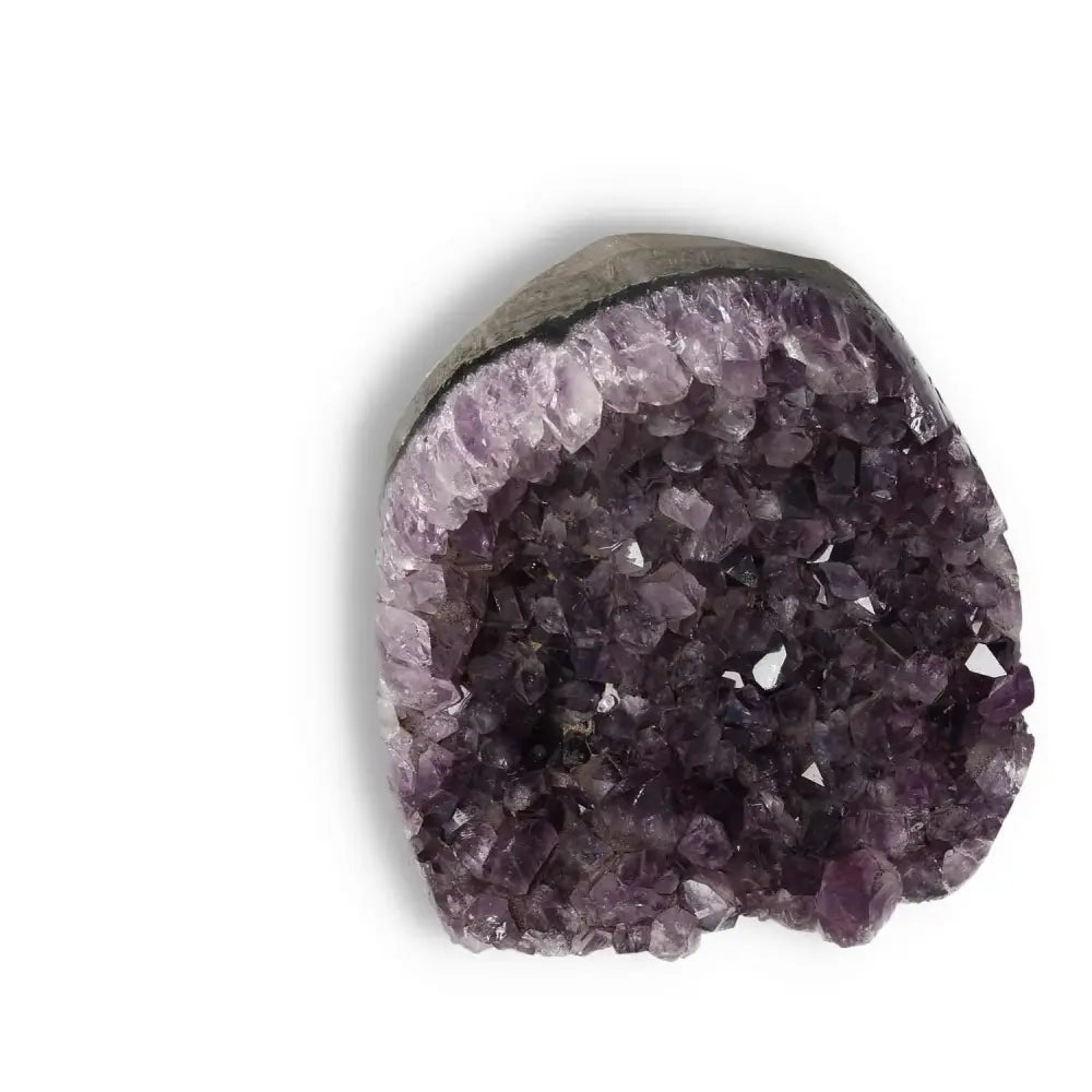 Premium Amethyst Cut Base Geode displaying its luxurious violet crystals; ideal for enhancing living spaces with elegance and spirituality.
