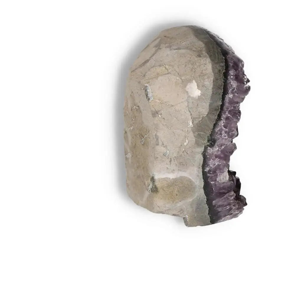 Amethyst Cut Base Geode by Sylvia Crystals, showcasing a blend of natural elegance and spiritual serenity for home decor.