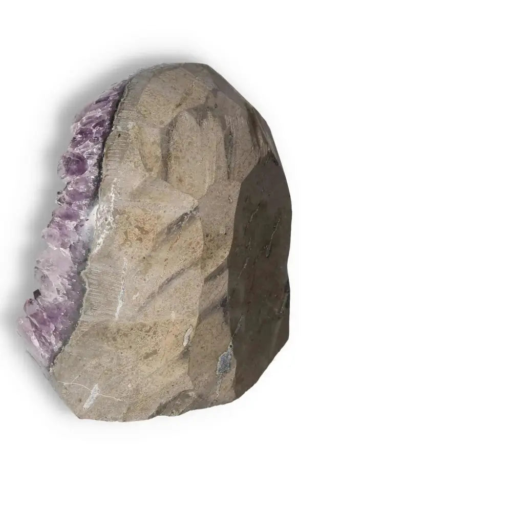 Side view of Amethyst Cut Base Geode by Sylvia Crystals, showcasing its natural beauty and luxurious appeal.