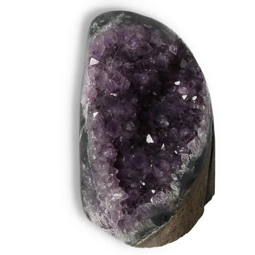 Amethyst Cut Base Geode from Sylvia Crystals, showcasing natural purple allure and calming properties, enhancing any space.