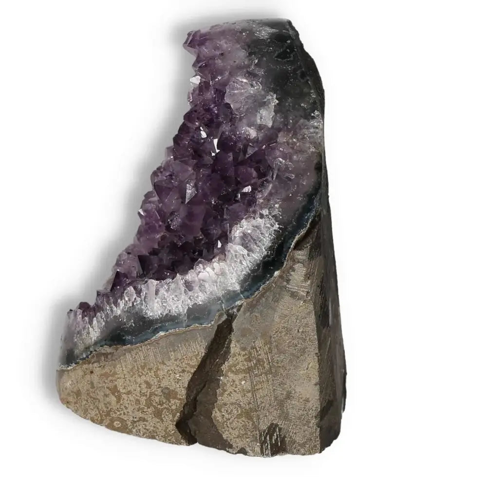 Amethyst Cut Base Geode showcasing purple crystals, symbolizing luxury and spirituality from Sylvia Crystals. Ideal for reducing stress.