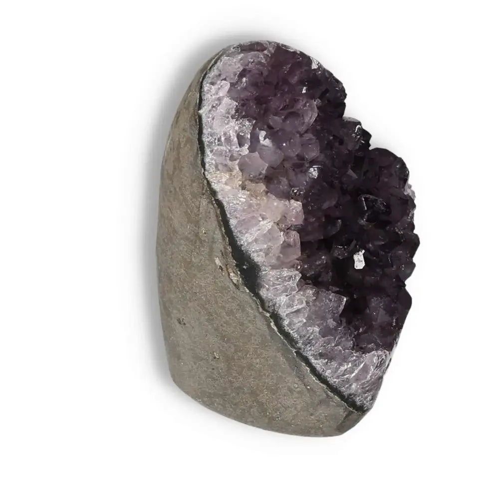 Amethyst Cut Base Geode from Sylvia Crystals, showcasing deep purple crystals ideal for stress reduction and emotional balance.