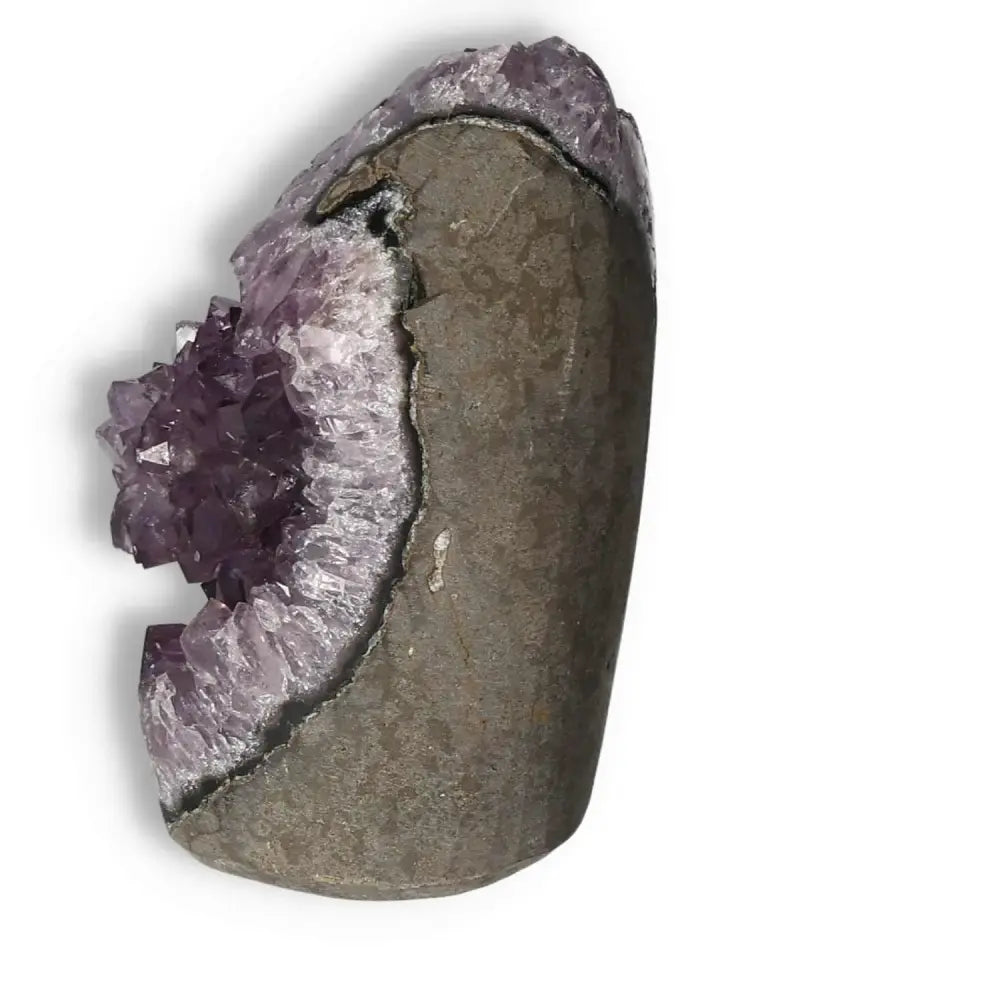 Side view of a premium Amethyst Cut Base Geode showcasing vibrant purple crystals, ideal for emotional stability and stress reduction.