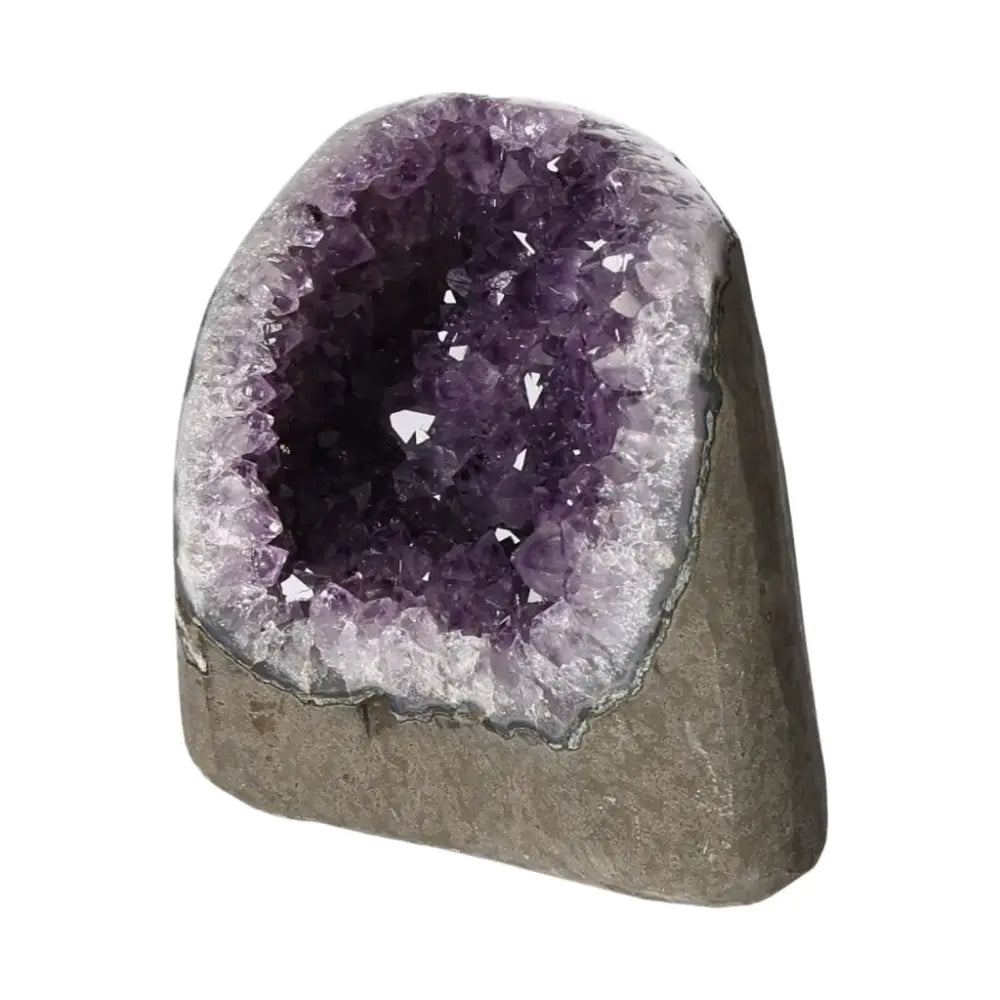 Amethyst Cut Base Geode from Sylvia Crystals with deep purple hues and unique formation, symbolizing peace and spiritual harmony.