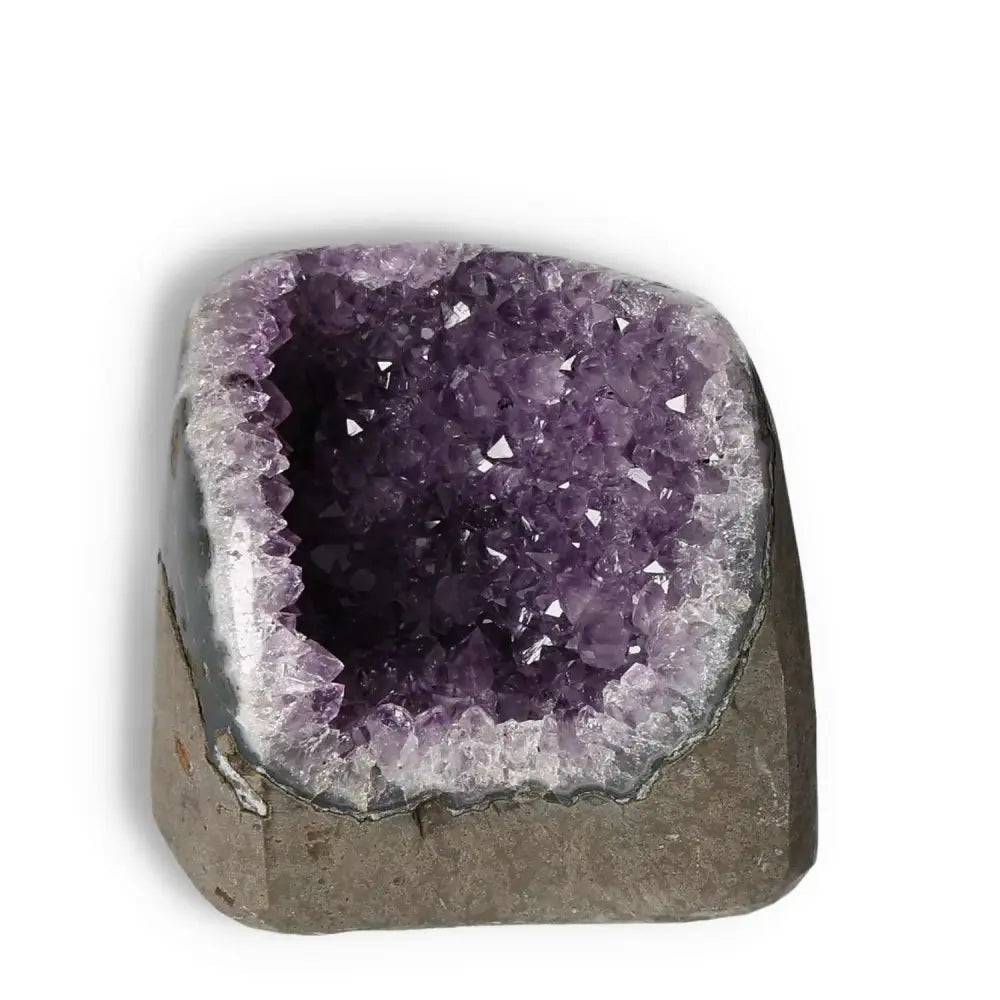 Amethyst Cut Base Geode from Sylvia Crystals featuring deep purple hues, symbolizing peace and spirituality.