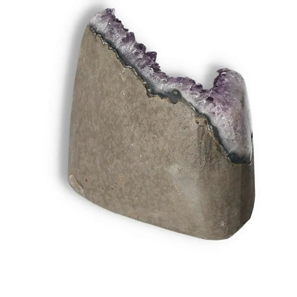 Amethyst Cut Base Geode with deep purple crystals, symbolizing peace and spirituality, from Sylvia Crystals.