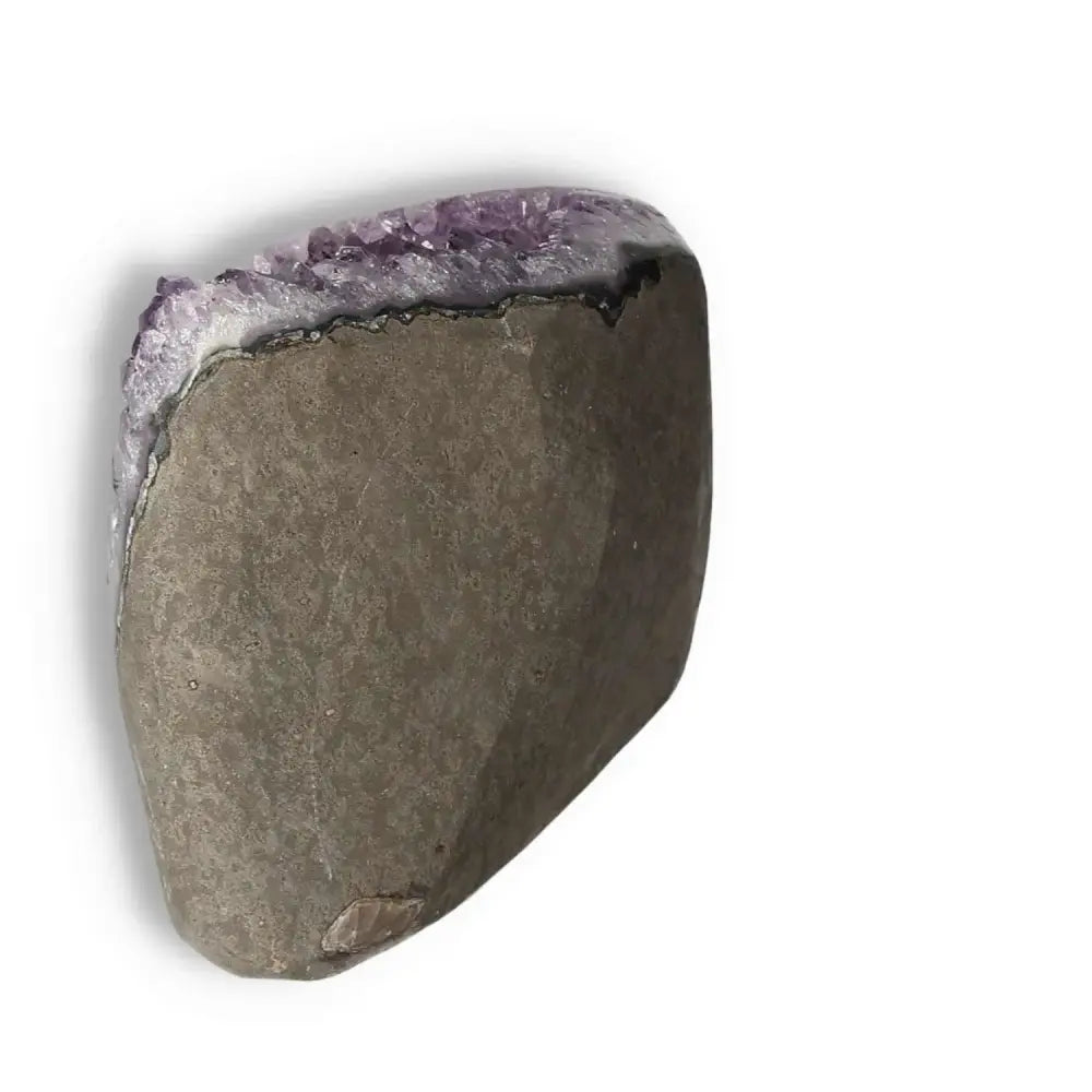 Amethyst Cut Base Geode from Sylvia Crystals showcasing deep purple hues and unique formation on white background.