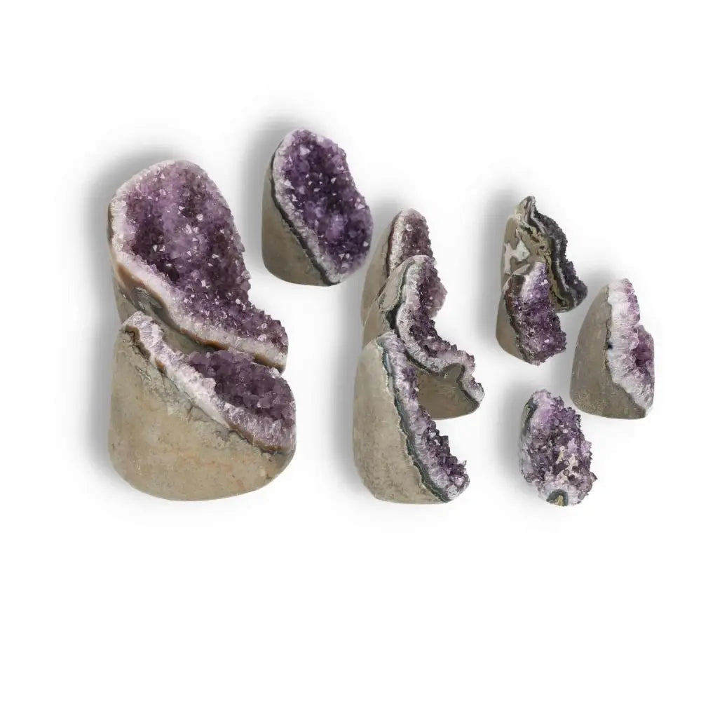 Amethyst cut base geodes 0.1-1 kg from Sylvia Crystals, showcasing violet hues and natural formations for luxury and spiritual wellness.