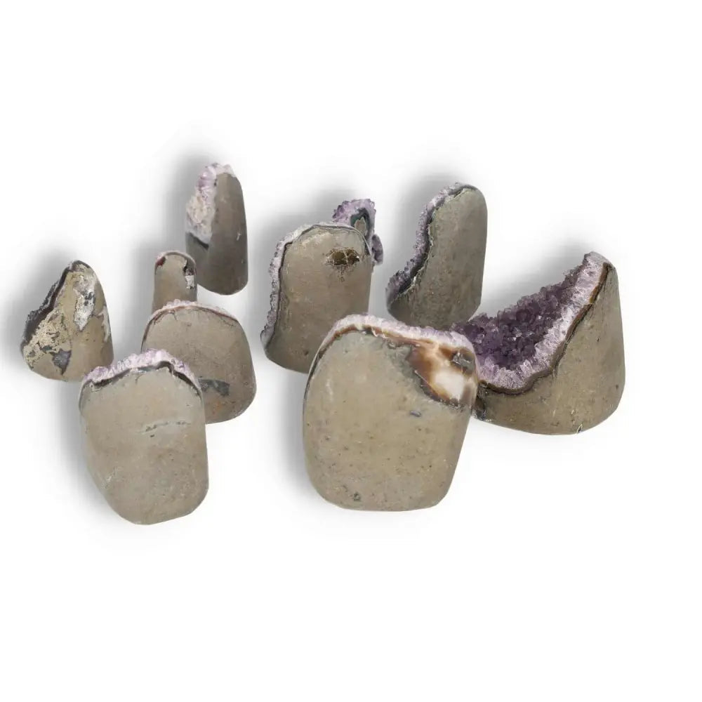 Display of premium Amethyst cut base geode 0.1-1 kg, showcasing natural beauty and spiritual benefits from Sylvia Crystals.