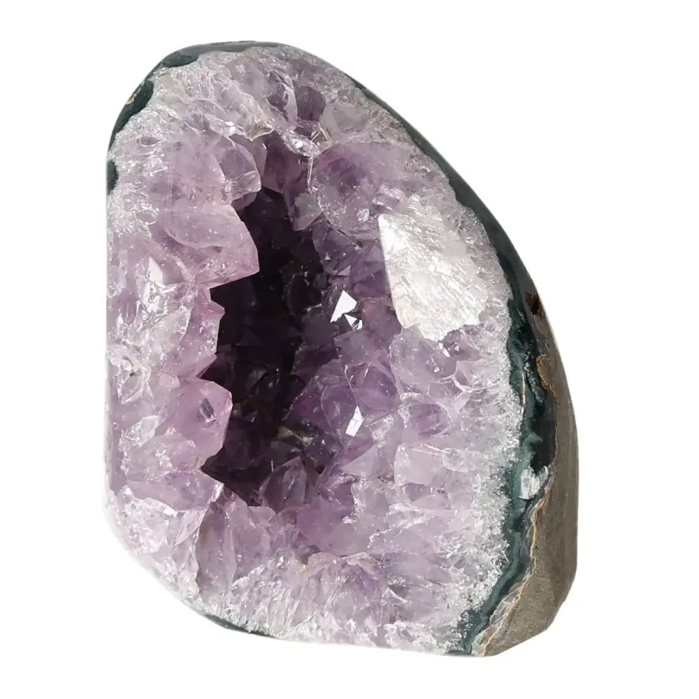 Amethyst cut base geode from Sylvia Crystals showcasing deep purple brilliance and natural beauty, embodying luxury and spirituality.