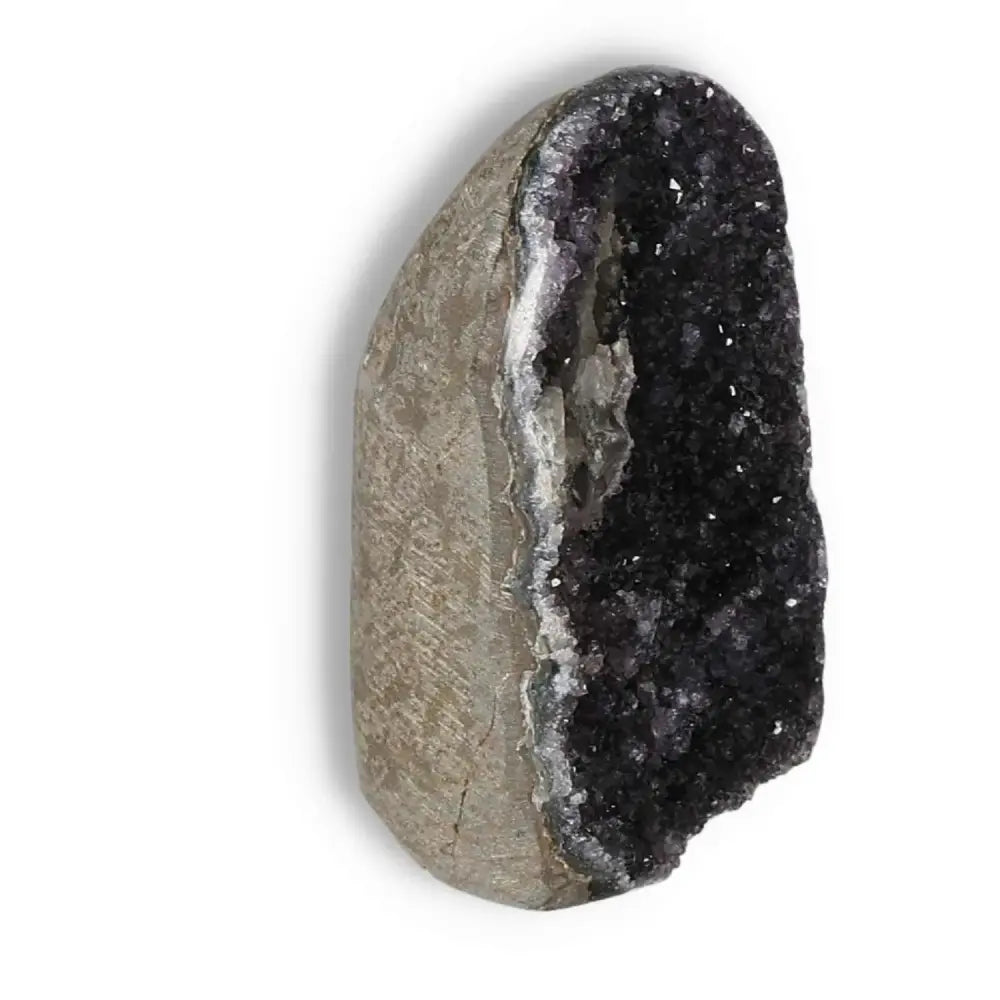 Amethyst cut base geode with deep purple crystals, offering calming properties, from Sylvia Crystals. Handpicked for premium quality.