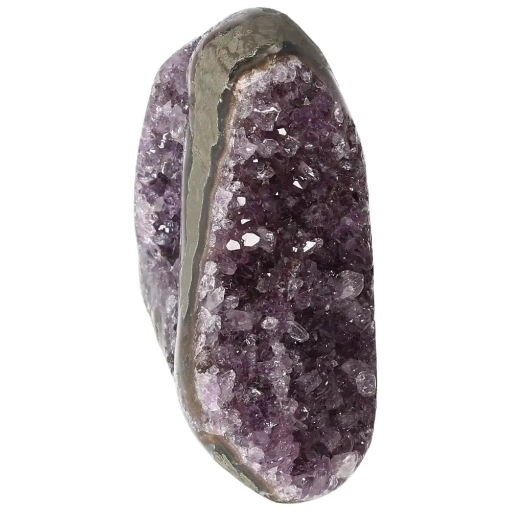 Amethyst cut base geode by Sylvia Crystals, symbolizing tranquility and energy balance, ideal for spiritual collections.