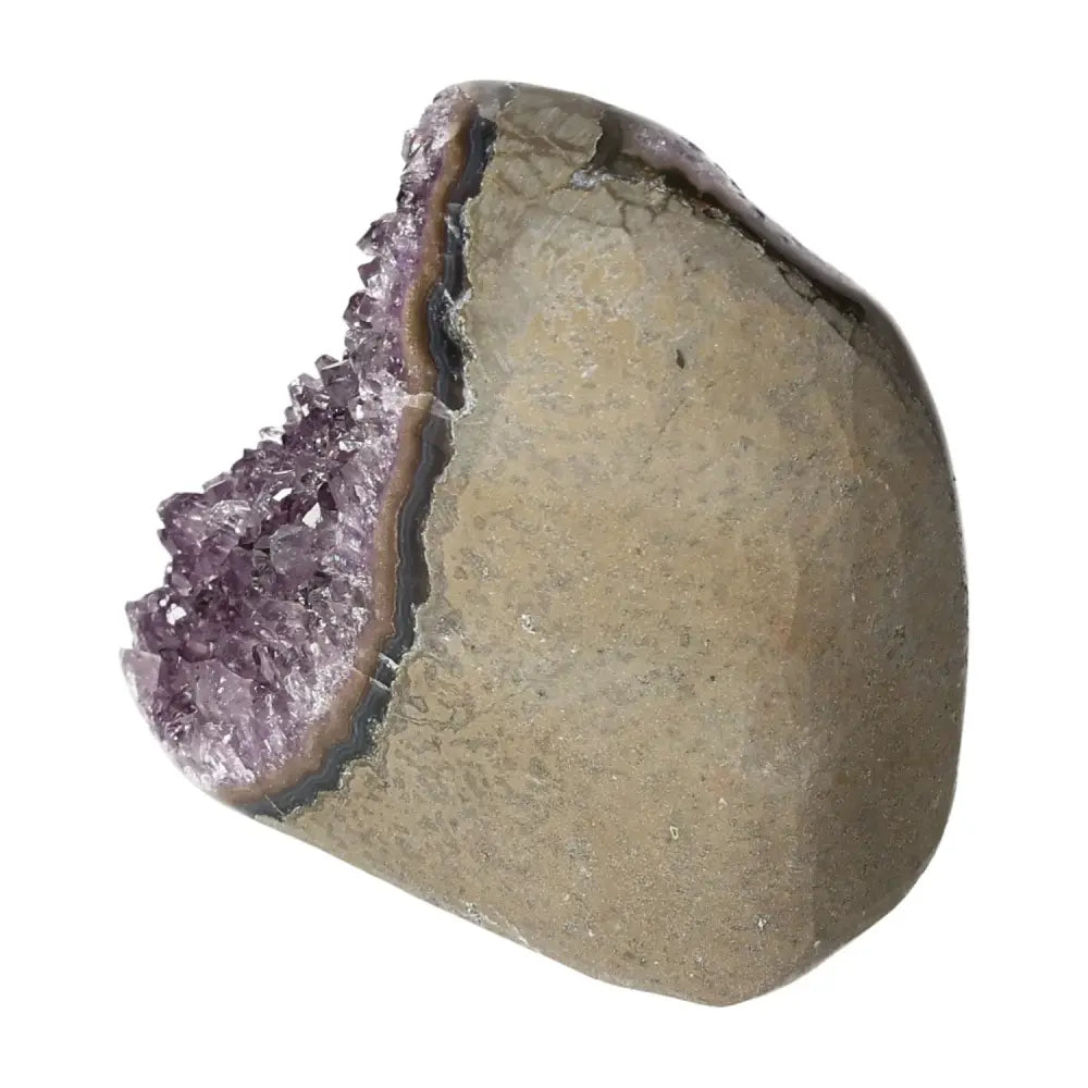 Amethyst cut base geode from Sylvia Crystals, promoting tranquility and energy balance, ideal for spiritual or aesthetic collections.