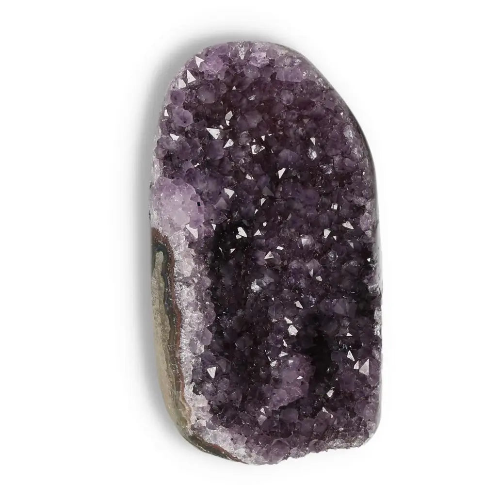 Amethyst cut base geode from Sylvia Crystals showcasing deep purple hues and sparkling crystals, ideal for stress relief and concentration.