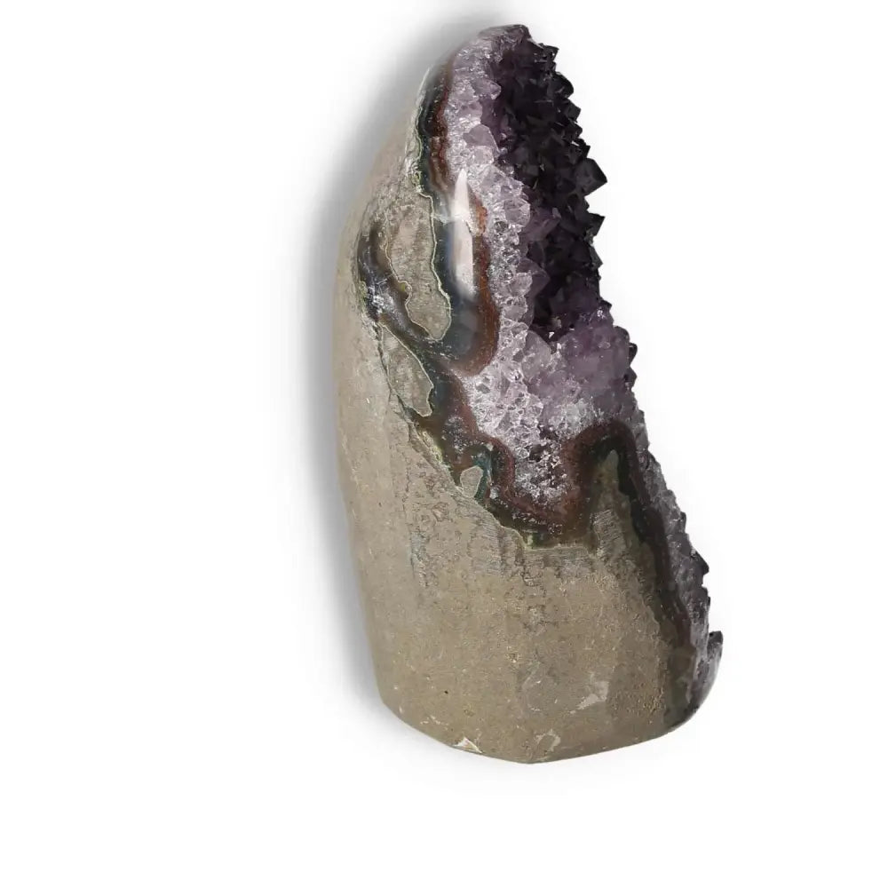 Amethyst cut base geode by Sylvia Crystals, showcasing raw luxury and spiritual allure, ideal for stress reduction and concentration enhancement.