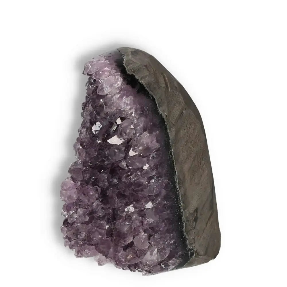 Amethyst cut base geode with premium clarity from Sylvia Crystals; known for stress reduction and concentration enhancement.