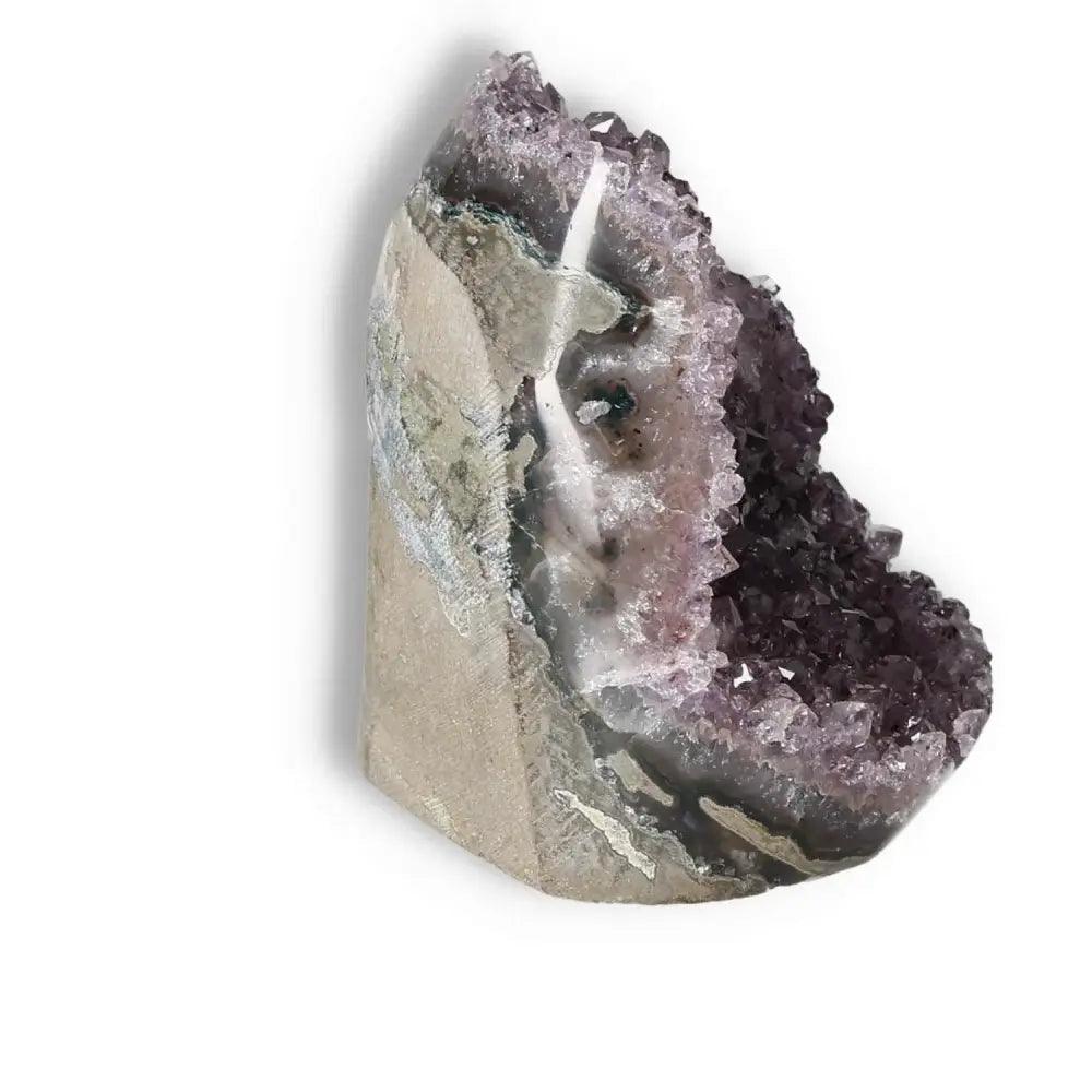 Amethyst cut base geode with deep purple crystals, enhancing lifestyle and well-being, by Sylvia Crystals.