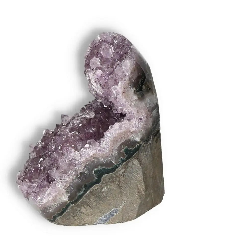 Amethyst cut base geode from Sylvia Crystals, showcasing deep purple hues and natural elegance for stress reduction and emotional stability.