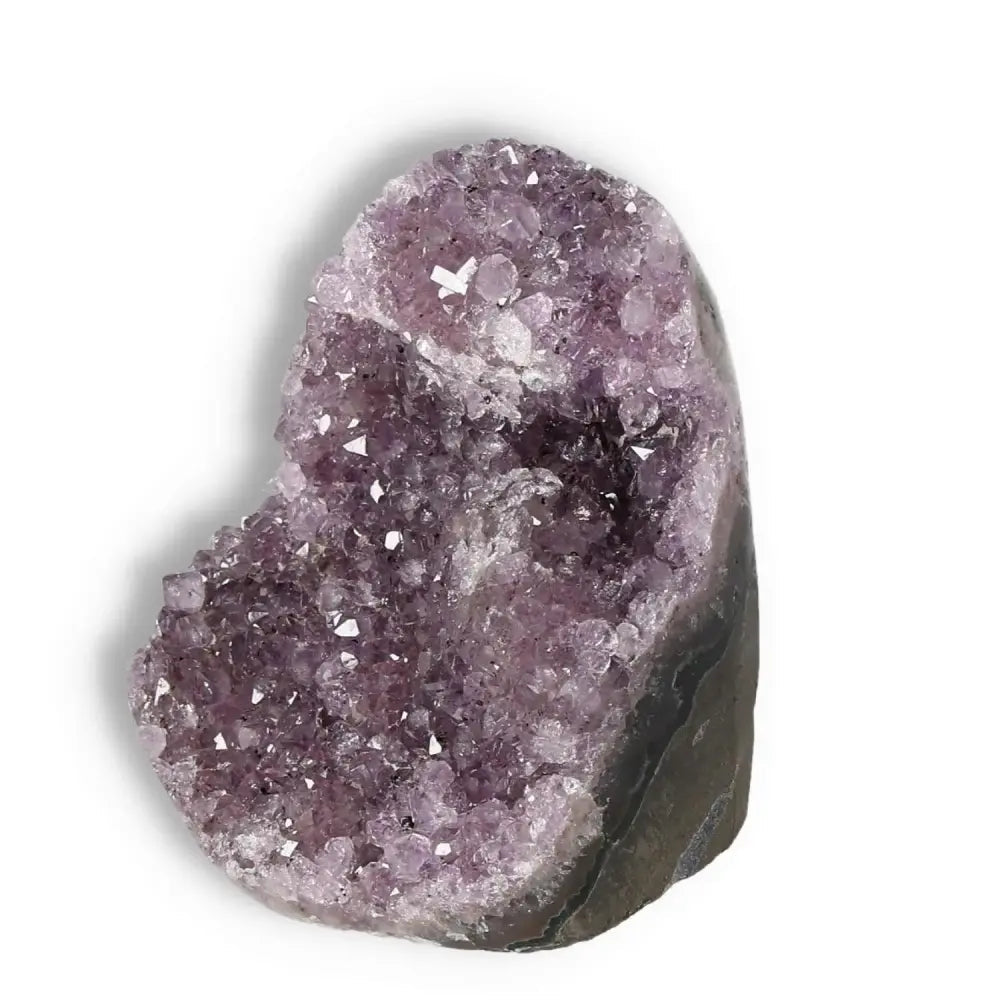 Amethyst cut base geode by Sylvia Crystals with deep purple hues, ideal for enhancing well-being and emotional stability.
