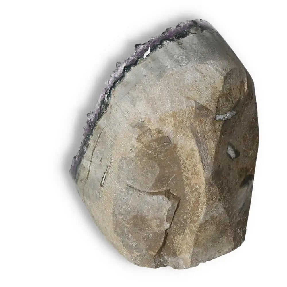 A premium Amethyst cut base geode from Sylvia Crystals, showcasing luxury and spiritual elegance with a natural, earthy finish.