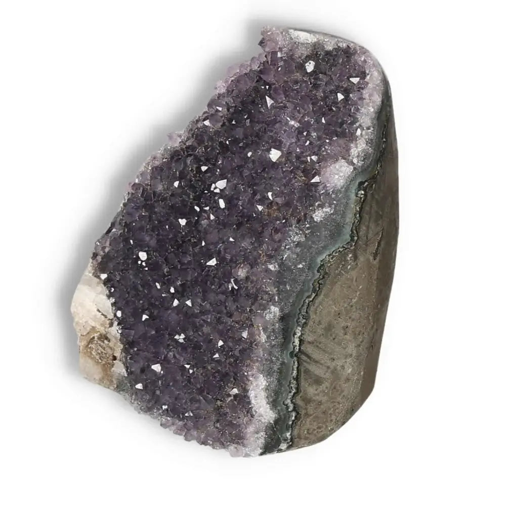 Amethyst cut base geode with sparkling purple crystals by Sylvia Crystals, ideal for stress reduction and enhancing emotional stability.