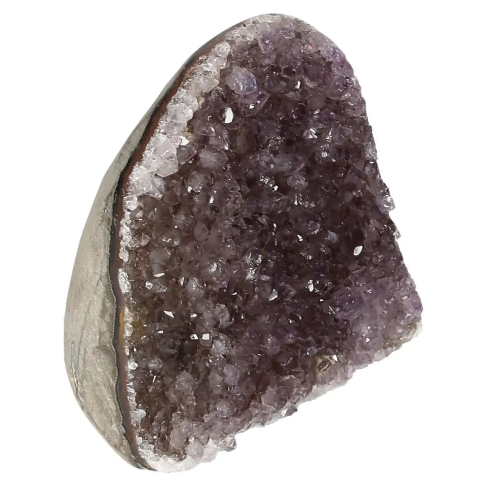 Amethyst cut base geode with deep purple crystals, offering stress reduction and enhanced concentration qualities by Sylvia Crystals.