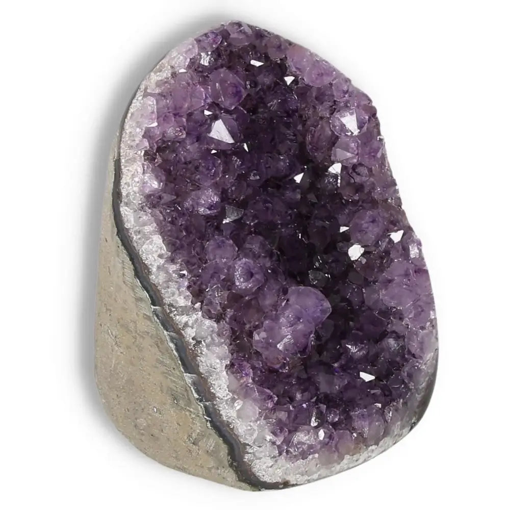 Amethyst cut base geode showcasing vibrant purple crystals for spiritual well-being, stress relief, and enhanced concentration.