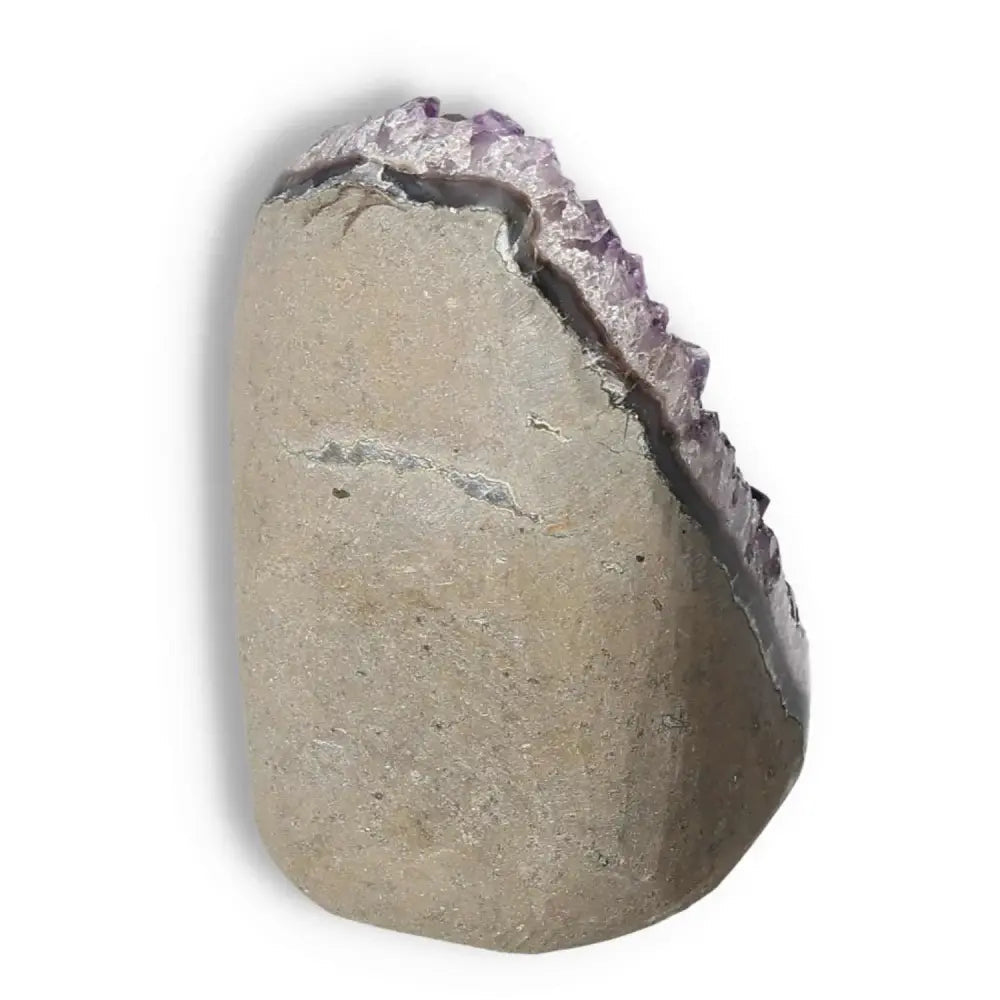 Amethyst cut base geode from Sylvia Crystals showcasing natural beauty and stress-relieving properties, ideal for meditation spaces.