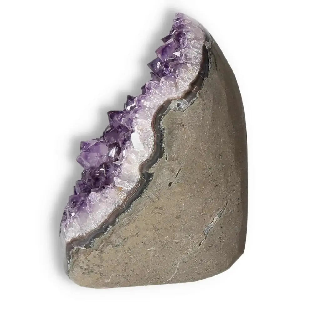 Amethyst cut base geode with purple crystals for stress relief and meditation, offered by Sylvia Crystals.