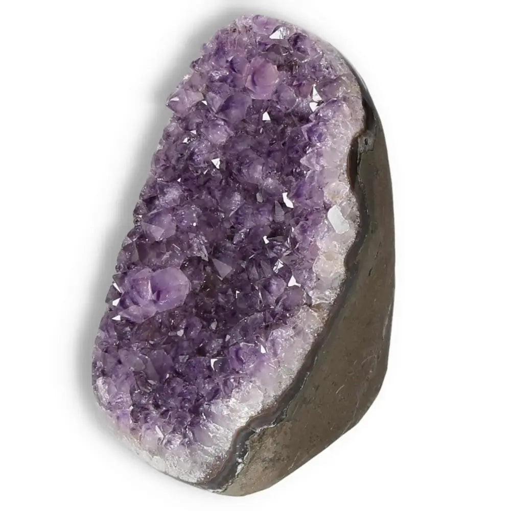 Purple amethyst cut base geode from Sylvia Crystals, ideal for meditation and stress relief, featuring natural crystal formations.