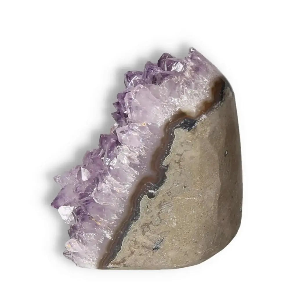 Amethyst cut base geode showcasing purple crystals, premium Sylvia Crystals product symbolizing luxury and natural beauty.