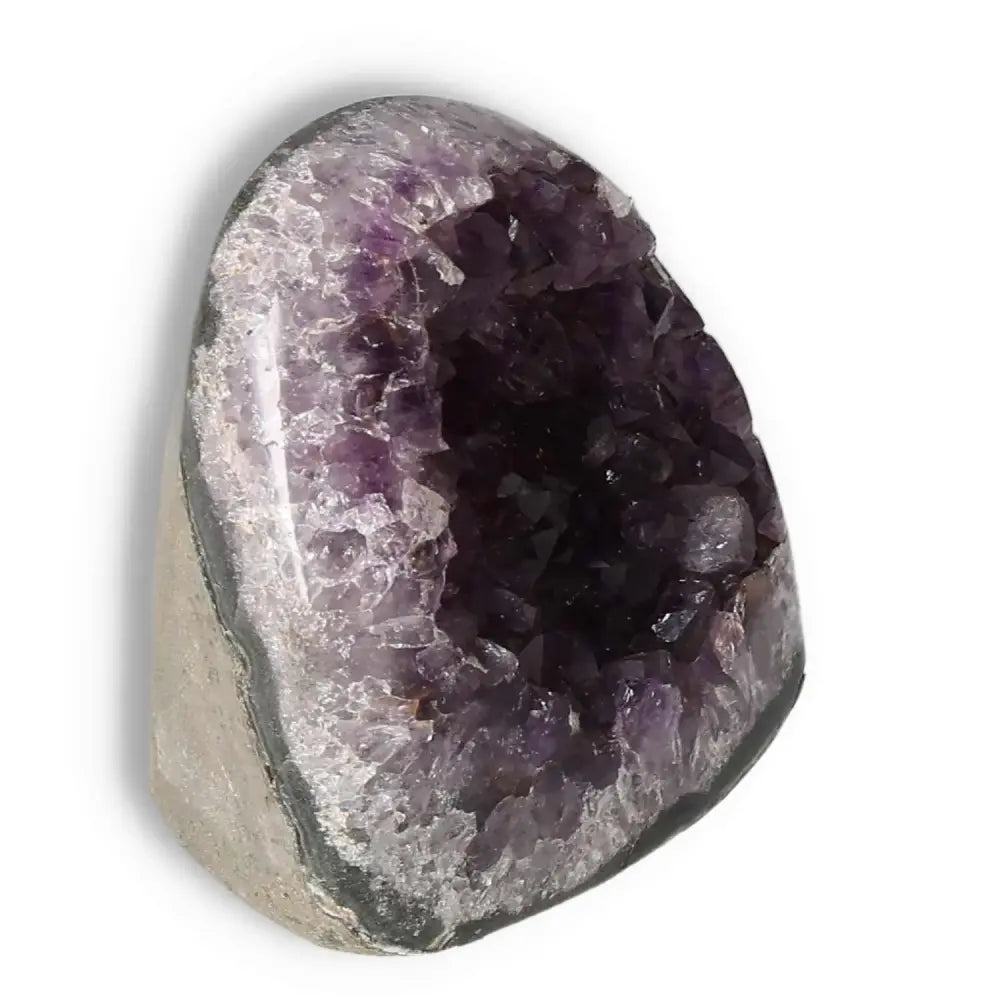 Amethyst cut base geode with deep purple hues by Sylvia Crystals, enhancing any space with natural splendor and tranquility.