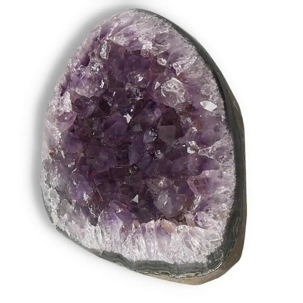 Amethyst cut base geode with deep purple hues, handpicked by Sylvia Crystals, offering natural beauty and tranquility.