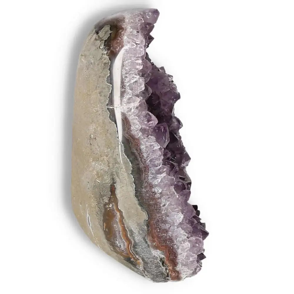 Amethyst cut base geode by Sylvia Crystals, showcasing luxury and elegance with unique spiritual properties.