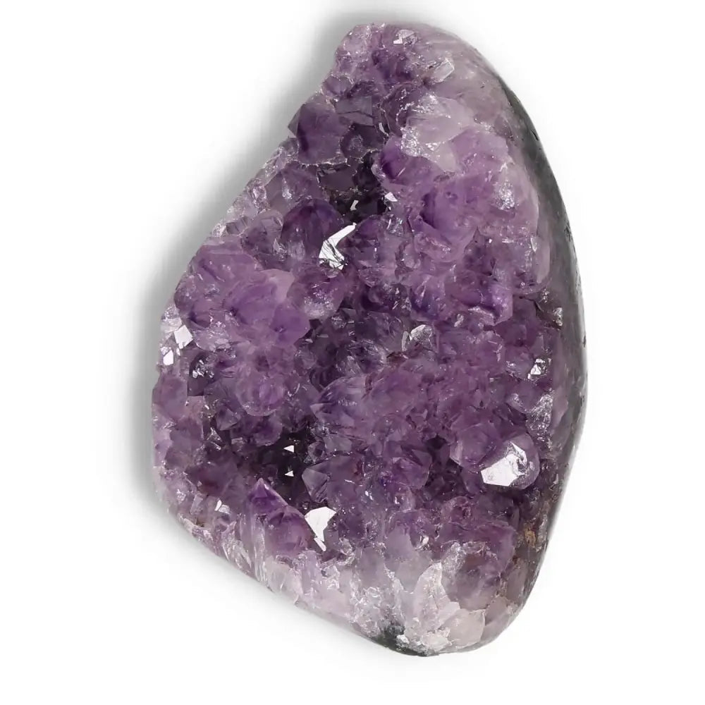 Amethyst cut base geode by Sylvia Crystals, showcasing vibrant purple hues and natural elegance for stress relief and spiritual harmony.